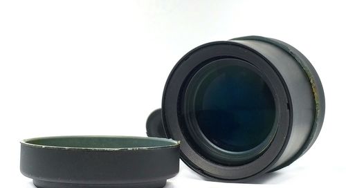 Close-up of camera against white background