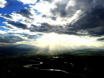 Scenic view of landscape against cloudy sky