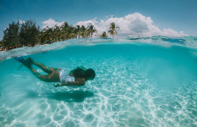 Woman swimming in sea