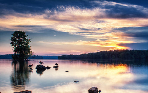 Scenic view of lake against sky during sunset