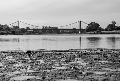 View of suspension bridge over river