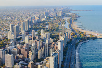 Aerial view of cityscape by sea