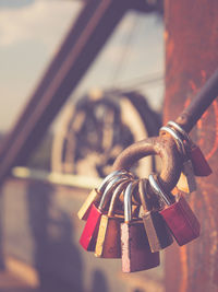 Close-up of padlocks on railing