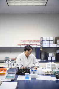 Portrait of young woman working in office