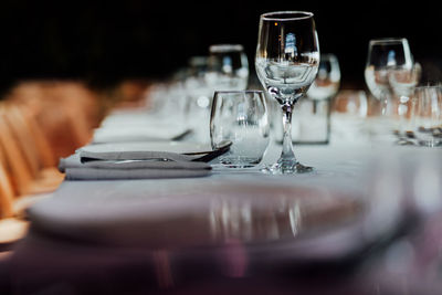 Luxury table settings for fine dining with and glassware, pouring wine to glass. 