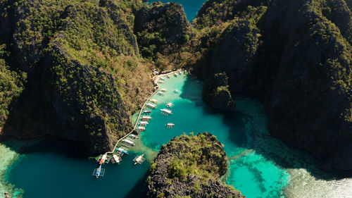 Lagoons and coves with blue water among the rocks. lagoon, kayangan covered with forests