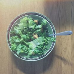 Close-up of green leaf on table