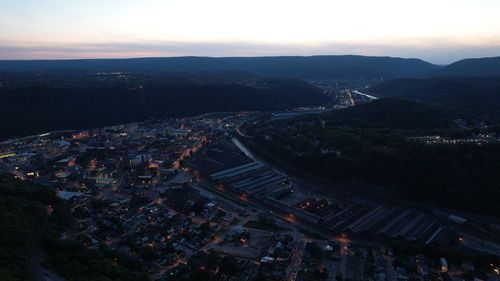 High angle view of illuminated buildings in city at night