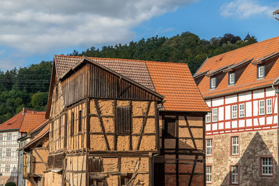 Houses against sky in city