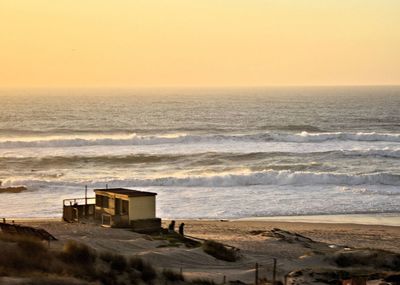 Scenic view of sea against clear sky during sunset
