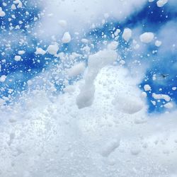 Man in snow against sky