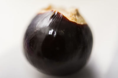 Close-up of fruit over white background