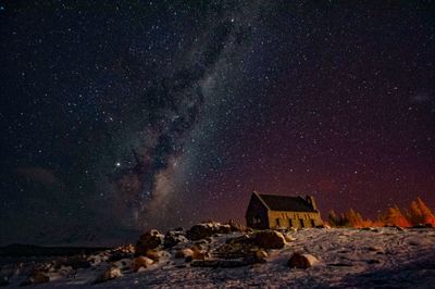 Scenic view of rocks against sky at night