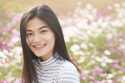 Close-up portrait of young woman at park