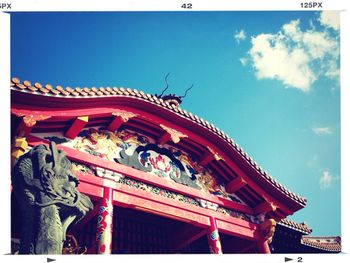 Low angle view of built structure against blue sky