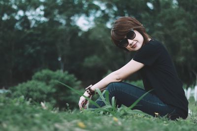 Woman wearing sunglasses on field