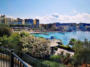 View of cityscape against sea