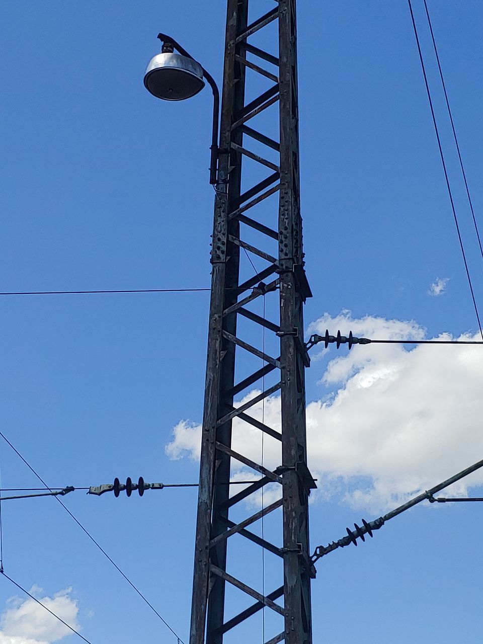 LOW ANGLE VIEW OF ELECTRICITY PYLONS AGAINST SKY