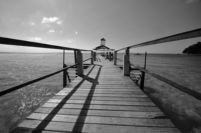 Pier over sea against sky