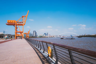 View of bridge over sea against blue sky