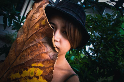 Close-up portrait of teenage girl in park