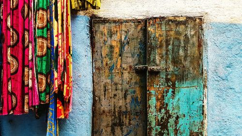 Close-up of closed weathered doors in building