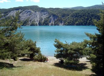 Scenic view of lake and mountains against sky