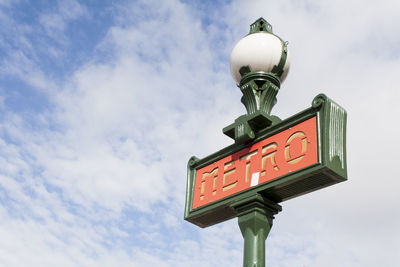 Low angle view of street light against sky