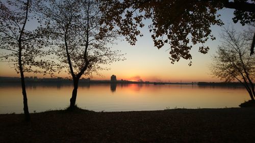 Scenic view of lake against sky during sunset