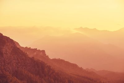 Scenic view of mountains against sky during sunset