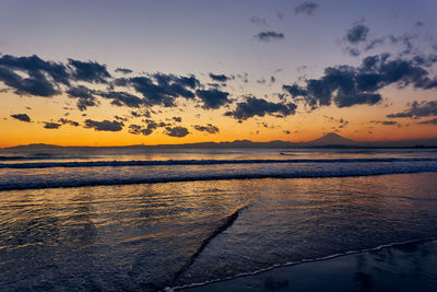 Scenic view of sea against sky during sunset