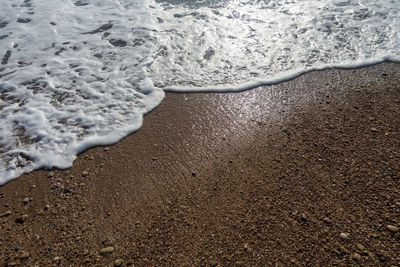 High angle view of surf on beach