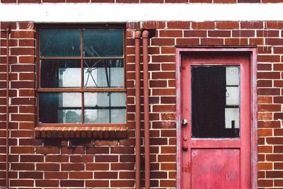 Brick wall with closed door and window