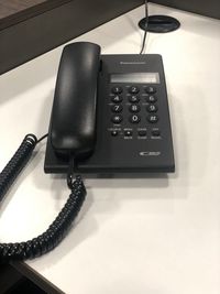 High angle view of telephone on table