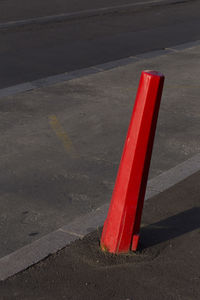 High angle view of red road sign on street in city