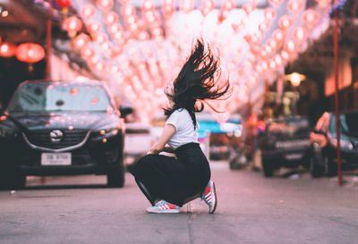 Full length of woman dancing outdoors