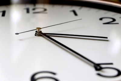 Close-up of clock against white background