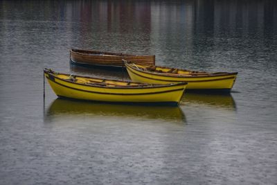 Fishing boats moored in lake