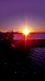 Scenic view of sea against clear sky during sunset