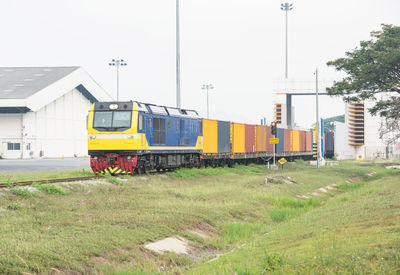 Train on railroad track against sky