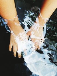 Hands in the water