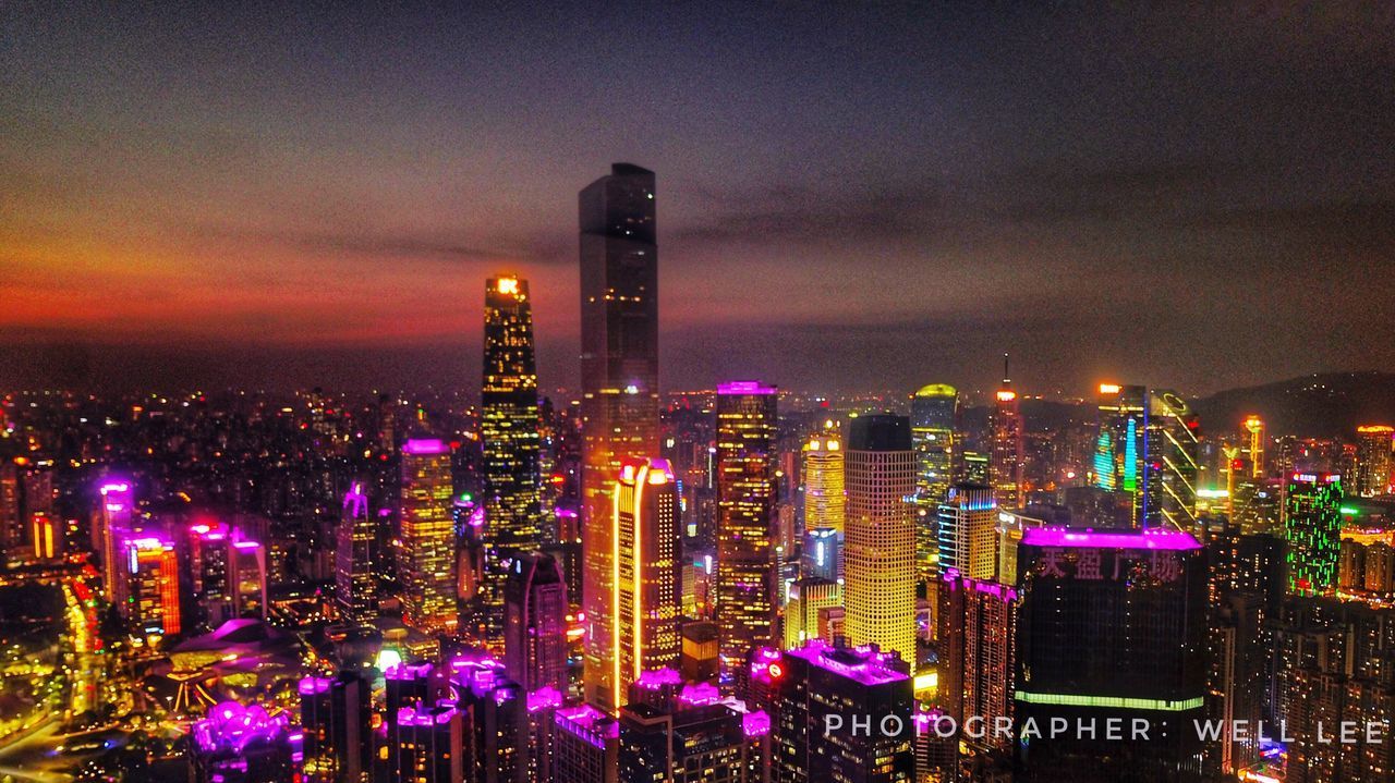 ILLUMINATED CITYSCAPE AT NIGHT