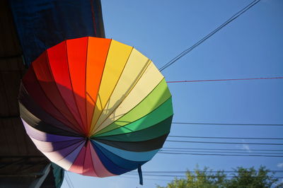 Low angle view of hot air balloon against blue sky