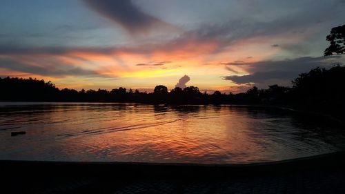 View of calm lake at sunset