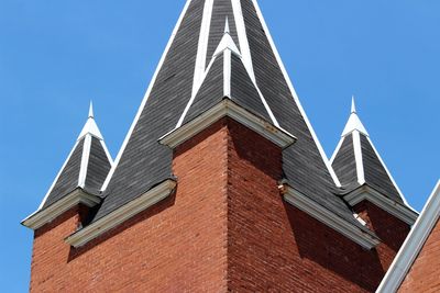 Low angle view of building against clear blue sky