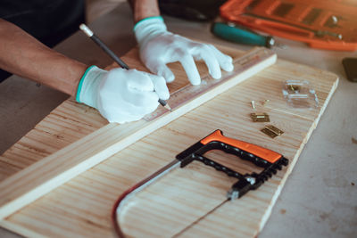 High angle view of man working on table