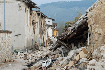 Abandoned building by construction mountains