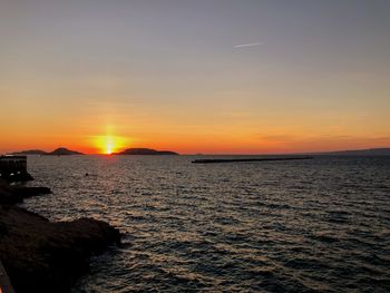 Scenic view of sea against sky during sunset