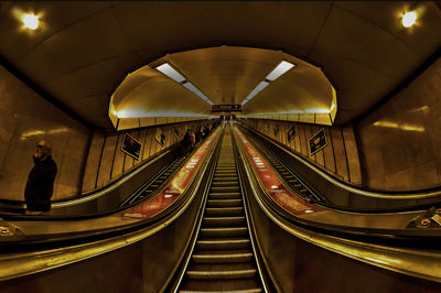 Illuminated escalator at night