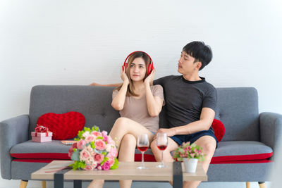 Young couple sitting on sofa